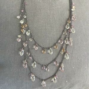 Universal Elegance - triple strain beaded necklace w/ silver hardware.
